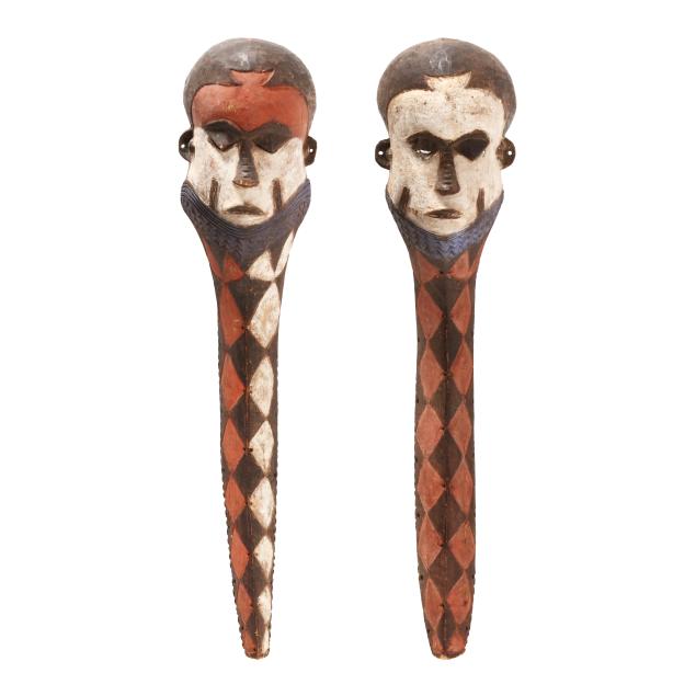 a-pair-of-large-african-carved-and-polychrome-masks