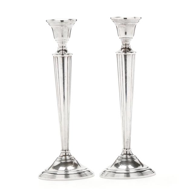 a-pair-of-sterling-silver-candlesticks-retailed-by-cartier