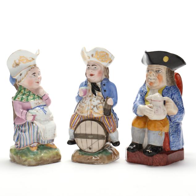 three-antique-toby-jugs