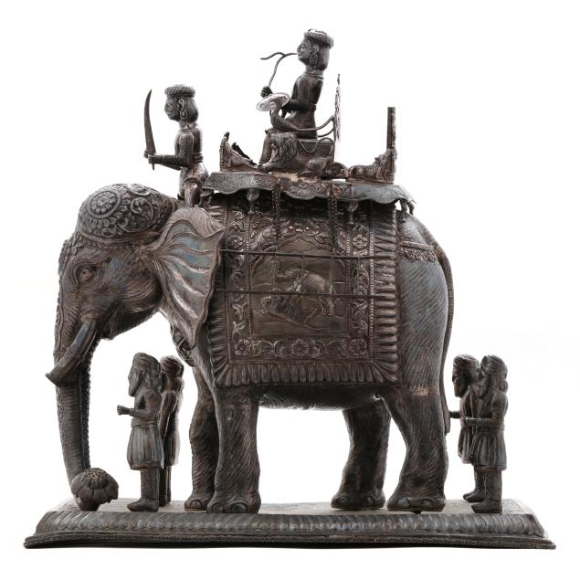 an-indian-elephant-with-rider-and-attendants