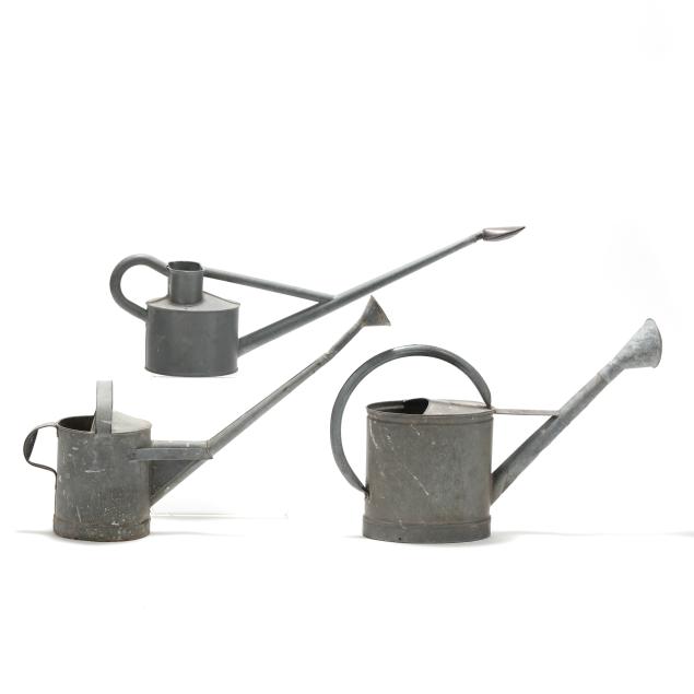 three-vintage-galvanized-metal-watering-cans