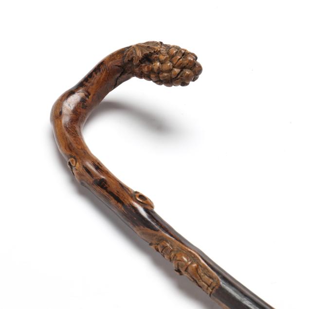 an-antique-carved-wood-wine-maker-s-cane