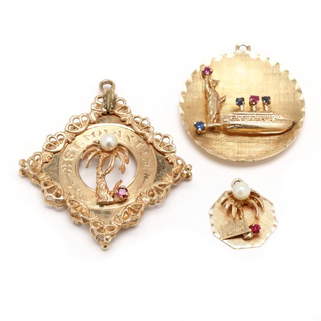 three-vintage-gold-and-gem-set-travel-related-charms