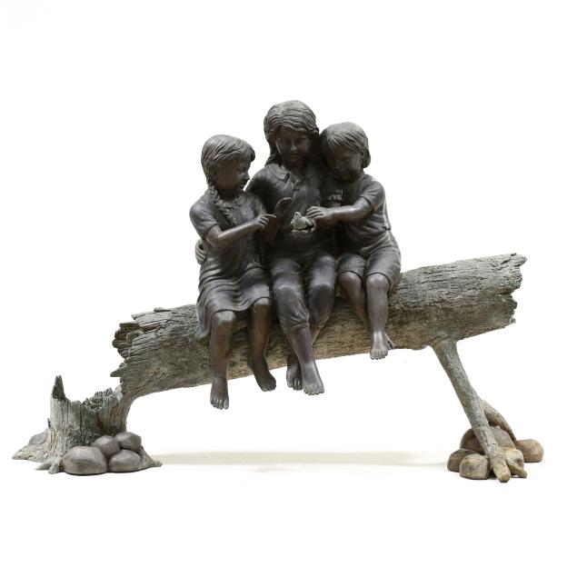 a-large-bronze-garden-statue-of-three-children-holding-bird